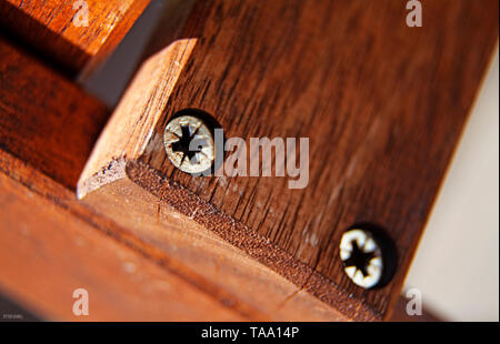 two screws in wood plank Stock Photo