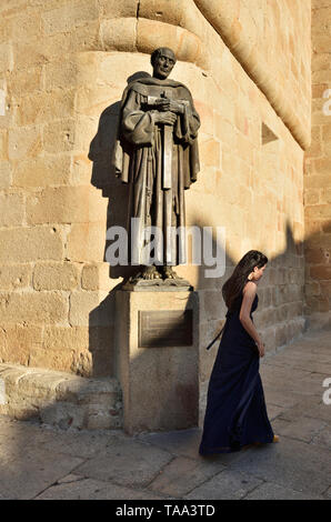 Street scene with the statue of San Pedro de Alcantara. A Unesco World Heritage Site. Caceres, Spain Stock Photo