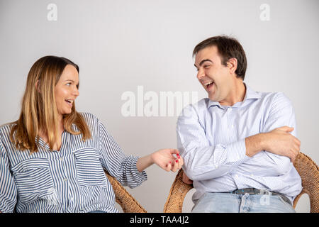 Casual Couple Pose In Studio Background With Hands In Pockets Stock Photo -  Download Image Now - iStock