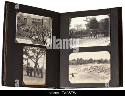 Four photo albums of an embassy or military member Partly inscribed albums with approx. 390 photographs, timeframe 1920s - 30s. Shown are soldiers, portrays and groups with uniform and decoration details. Transport of troops on river, aerial views of barracks, cavalry steeplechase, practice firing, encampments, sleeping quarters, mustering and parades etc. Mainly military but also civilian photographs. Furthermore roads, factories, events, landscapes, freighters 'Kobe Maru' and 'Kamo'. Two albums with Japanese inscriptions, leather and linen cove, Additional-Rights-Clearance-Info-Not-Available Stock Photo