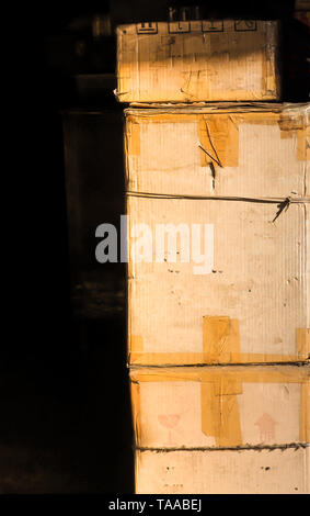 The old cardboard box on a black background.cargo.post.shipment delivery concept idea Stock Photo
