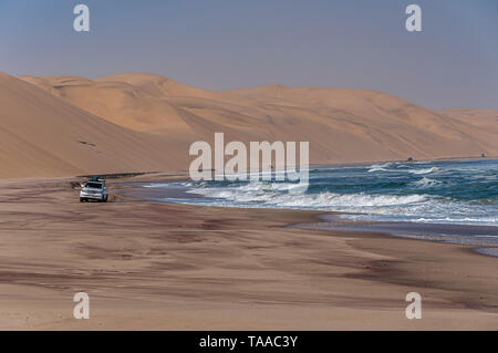 Tourists travel along the coast of Namibia in a convoy. Stock Photo
