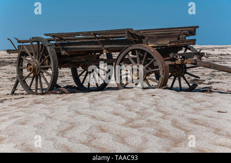 An old ox-wagon that was left abandoned in the Namib desert near the coast of Namibia. Stock Photo