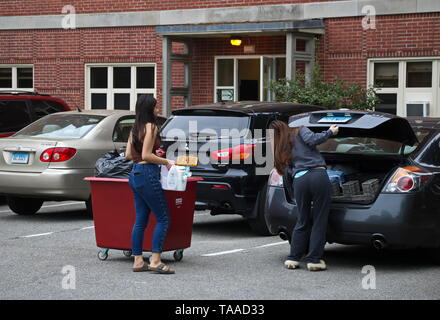 Storrs, CT / USA - May 10, 2019: A freshman moves out of the dorms with help from her friend Stock Photo