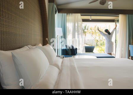 PHU QUOC, VIETNAM JUNE 28, 2017: Woman is in hotel room at the morning time Stock Photo