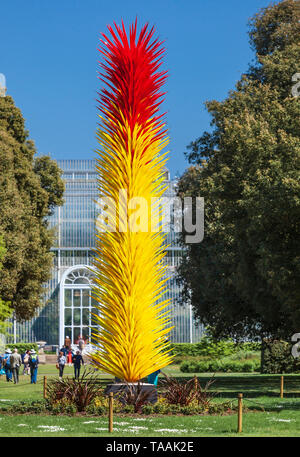 Dale Chihuly glass sculpture called ' Scarlet and Yellow Icicle Tower' at Kew Gardens. Stock Photo