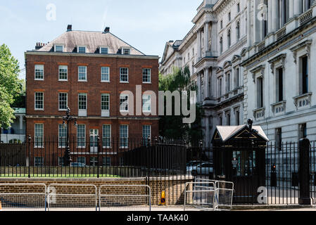 London, UK - May 14, 2019:  Back entrance gate to 10 Downing Street in the City of Westminster, London, UK. 10 of Downing Street is the residence of t