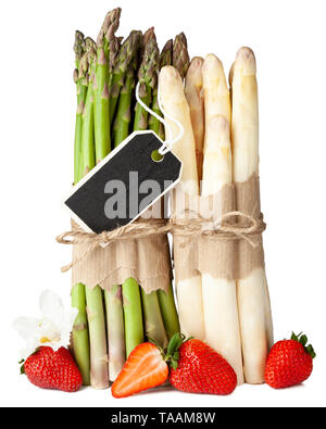 Fresh green and white asparagus with strawberries on isolated white background Stock Photo