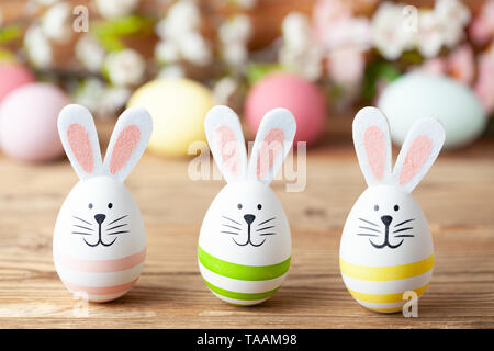 Happy easter background with easter bunny, easter eggs and flowers Stock Photo