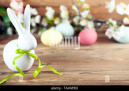 Happy easter background with easter bunny, easter eggs and flowers Stock Photo