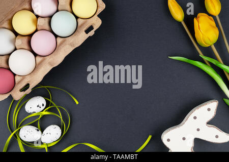 Easter background with easter eggs, easter bunny and flowers Stock Photo