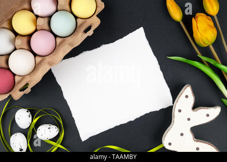 Easter background with easter eggs, easter bunny and flowers Stock Photo
