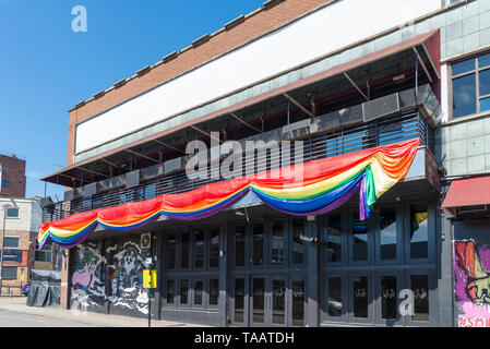 The rainbow flag on display outside The Nightingale gay club in Birmingham's gay quarter to celebrate Birmingham Pride gay lgbt festival Stock Photo