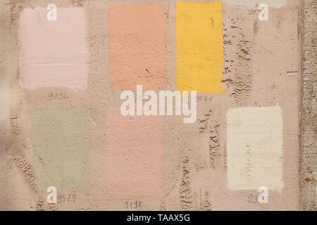 Paint samples on wall of old house before renovation Stock Photo