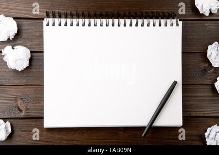 open blank notebook with crumpled paper Stock Photo