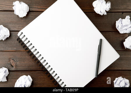open blank notebook with crumpled paper Stock Photo