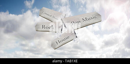 A wooden way-marker sign pointing to different music genres in a blue sky Stock Photo