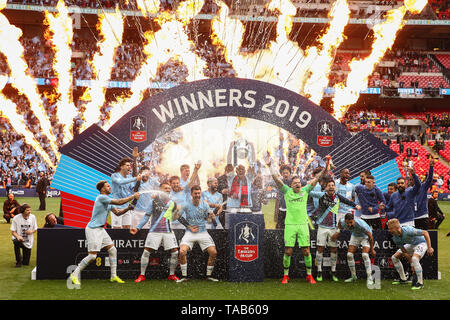 Vincent Kompany of Manchester City lifts the FA Cup trophy after his side beat Watford 6-0 - Manchester City v Watford, The Emirates FA Cup Final, Wembley Stadium, London - 18th May 2019  Editorial Use Only Stock Photo