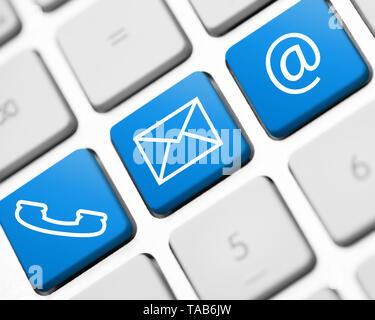 contact icons on white keyboard Stock Photo