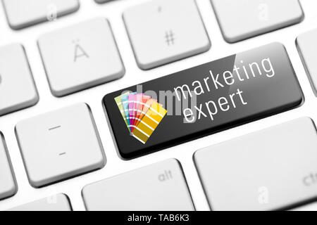 marketing expert key on keyboard Stock Photo