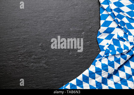 blue checkered bavarian tablecloth on a black background Stock Photo