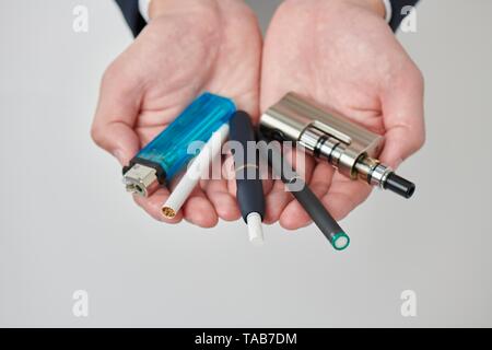 Young Japanese man smoking electronic cigarette Stock Photo - Alamy