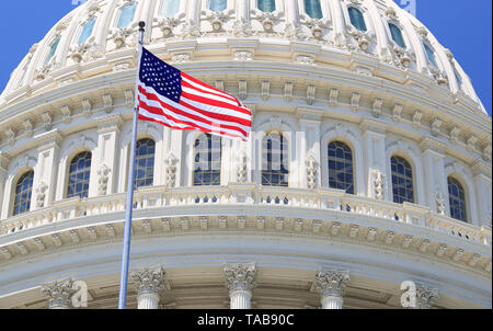 Capitol roof detail with American flag waving, Washington DC, USA Stock Photo