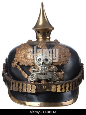 An Imperial German helmet M 1895 for enlisted men of Brunswick 92nd Infantry Regiment Large size leather body showing some crazing, black leather sweatband, brass line 'Fuerst' eagle with bright silver skull, crossbones and 'PENINSULA' banner, front plate attached by loops with leather straps, brass fittings, spike, base, spline and visor trim. Flat brass chinstraps with 91 lugs, EM national and Brunswick state cockades. USA-lot, see page 4. historic, historical, Braunschweig, Brunswick, German, Germany, Northern Germany, the North of Germany, ob, Additional-Rights-Clearance-Info-Not-Available Stock Photo