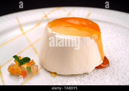 Italian food recipe, traditional  creamy dessert Panna Cotta with caramel garnishment Stock Photo