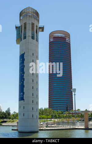 Torre Schindler observation tower on the Canal de Alfonso XIII with the Torre Sevilla tower block behind, Seville, Andalusia region, Spain Stock Photo