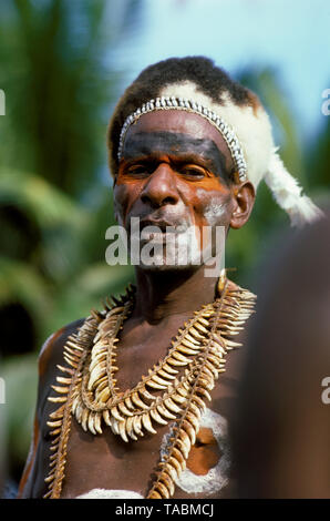 Asmat people: ethnic group living in the Papua province of Indonesia, along the Arafura Sea. Asmat man from the village of Agats or Sjuru. Photograph  Stock Photo