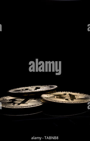 Bitcoins isolated on black background. Digital money. Stock Photo