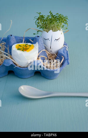 Easter decoration and breakfast egg in egg box Stock Photo