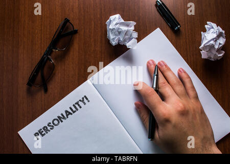 Writing note showing Personality. Business concept for combination characteristics that form individuals character Man hand resting pen open notebook  Stock Photo
