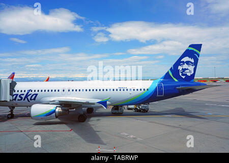 DENVER, CO -11 MAY 2019- View of an airplane from Alaska Airlines (AS) at the Denver International Airport, or DIA (DEN), at the foot of the Rocky Mou Stock Photo