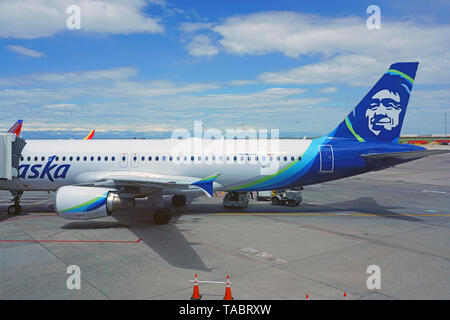 DENVER, CO -11 MAY 2019- View of an airplane from Alaska Airlines (AS) at the Denver International Airport, or DIA (DEN), at the foot of the Rocky Mou Stock Photo