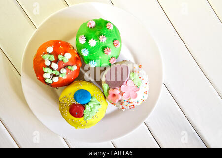 Delicious colorful cupcakes - Easter cakes. Homemade. Daylight. View from above Stock Photo