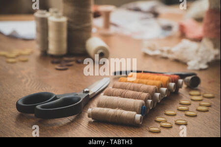Sewing concept. Scissors, threads and buttons. Stock Photo