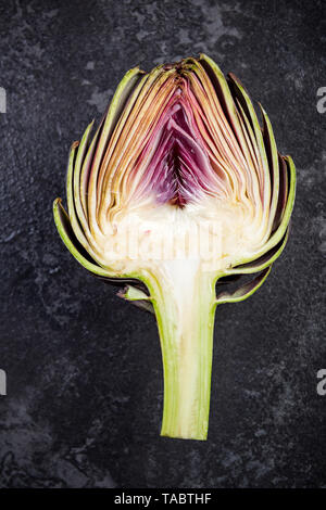 Artichoke flower bud cut in half, edible plant. Stock Photo