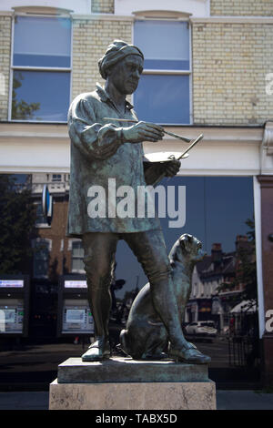 The statue of the painter William Hogarth and his pug dog Trump by sculptor Jim Mathieson , Chiswick High Road, London, W4 UK Stock Photo