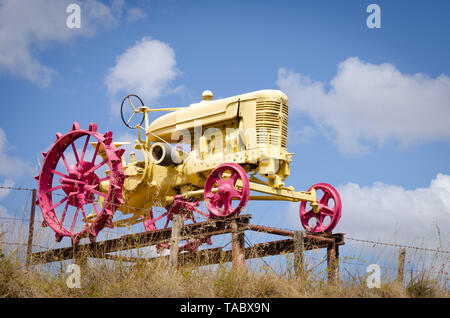 Vintage tractor on display by roadside, near Armidale, New South Wales, Australia Stock Photo
