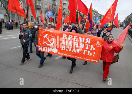 Magnitogorsk, Russia, - May, 1, 2019. “It's time to change power!” Is the inscription on the poster of the communists participating in the May Day dem Stock Photo