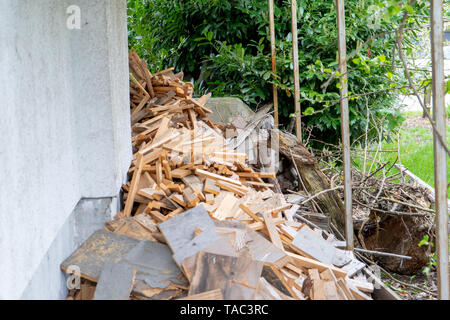 Pile of wood scraps cut up, or ready to be re-used and recycled, or otherwise considered junk rubbish. Wood from fence boards, or old furniture . Stock Photo