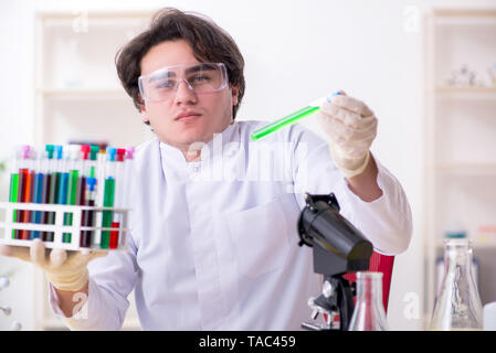Young male biochemist working in the lab Stock Photo