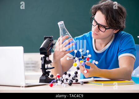 Young male student in the classroom Stock Photo