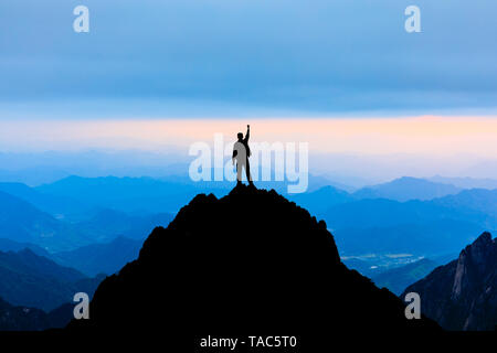 Happy man gesture of triumph with hands in the air,conceptual scene Stock Photo