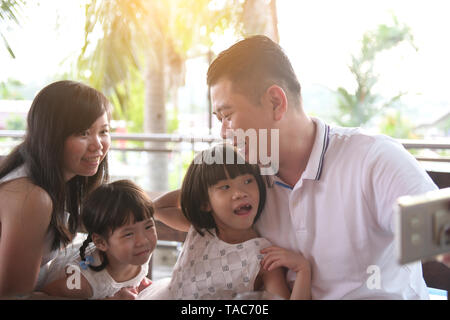 asian family taking selfie on outdoor Stock Photo
