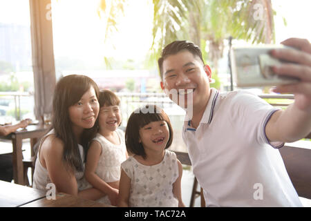 asian family taking selfie on outdoor Stock Photo
