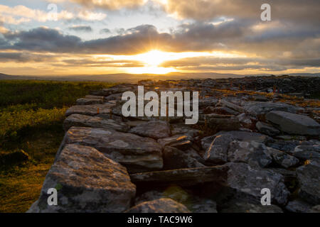 Knockdrum Stone Fort, West Cork, Ireland, 23rd May 2019, The sun sets over Knockdrum Stone Fort an ancient stone monolith in Castlehaven West Cork.  Credit aphperspective/ Alamy Live News Stock Photo