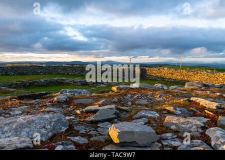 Knockdrum Stone Fort, West Cork, Ireland, 23rd May 2019, The sun sets over Knockdrum Stone Fort an ancient stone monolith in Castlehaven West Cork.  Credit aphperspective/ Alamy Live News Stock Photo